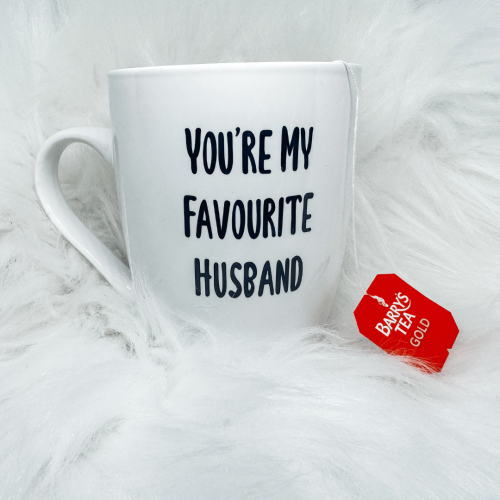 Close-up of ceramic mug showing text “You’re My Favourite Husband”