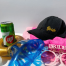 Bride-to-be accessories including black bride cap and pink sunglasses for a destination wedding