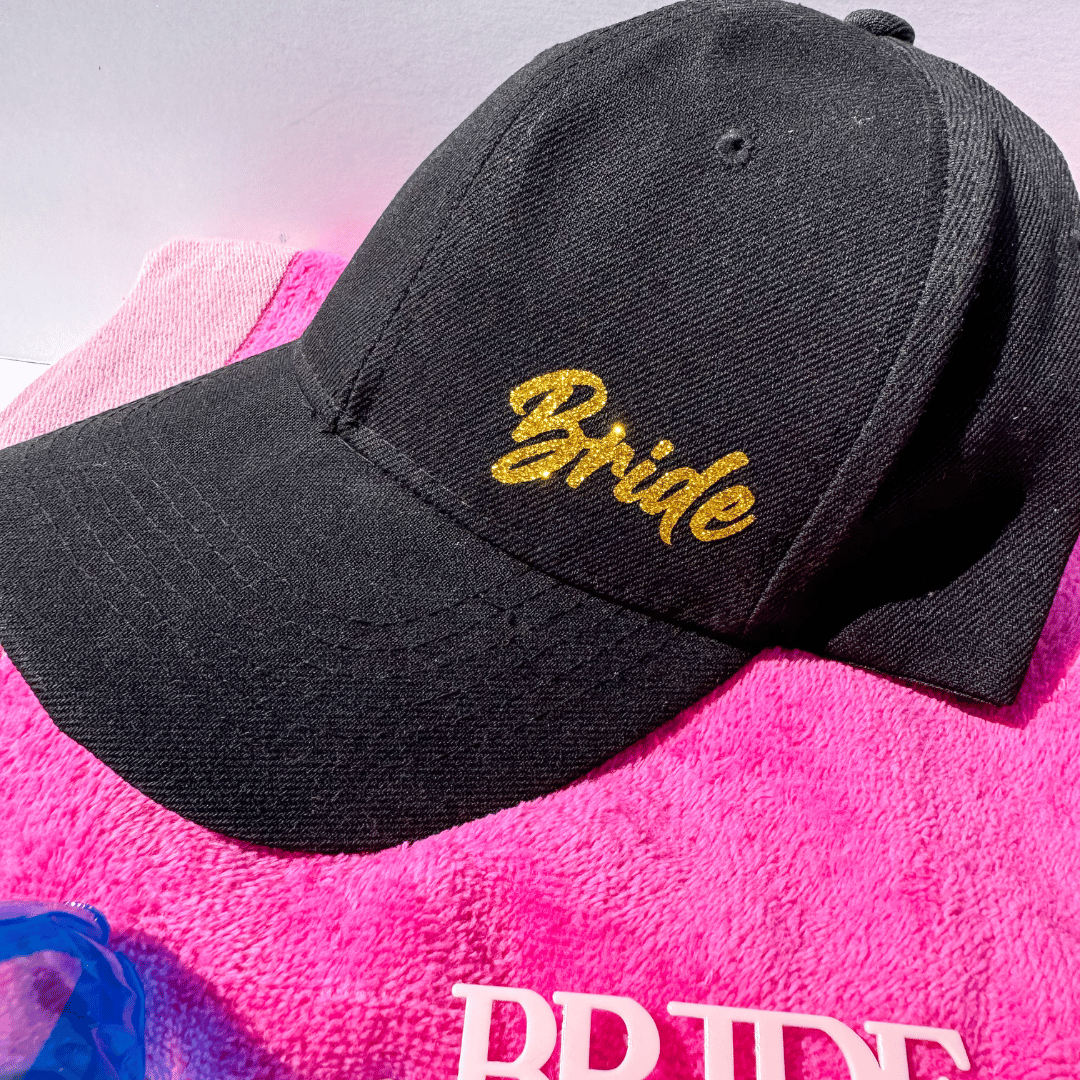 Bride gift box for weddings abroad with chic bridal cap and pink bride-to-be sunglasses