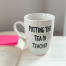 Funny teacher mug with “Putting the Tea in Teacher” text on white ceramic cup