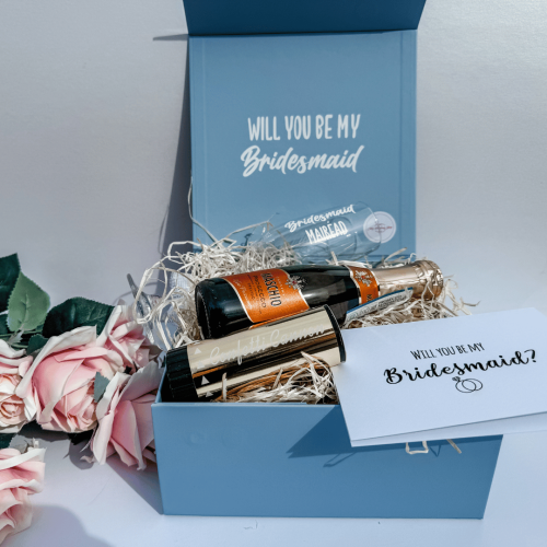 Inside the Something Blue Bridesmaid Proposal Box featuring personalised keepsakes and celebration treats.