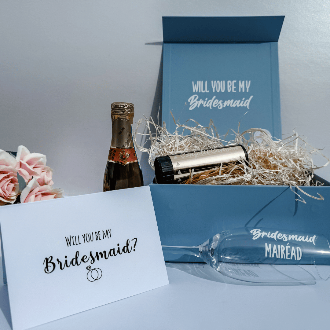 Personalised bridesmaid champagne flute inside elegant pale blue keepsake gift box.